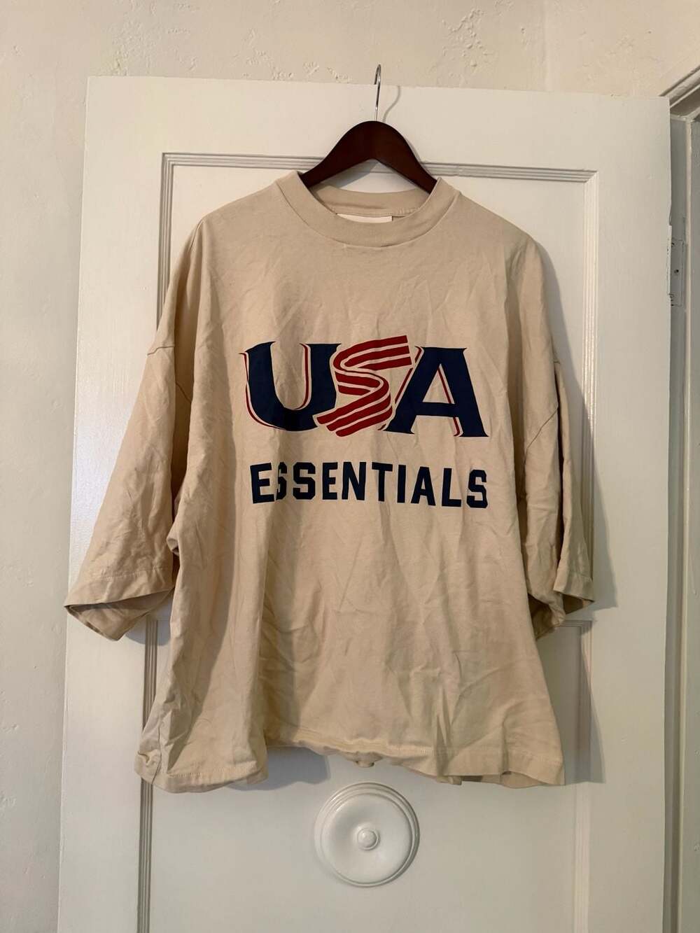 Fear of God Essentials USA Baseball Merch Tee Oat